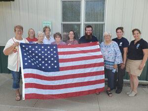 Members of the Clark County Chapter, NSDAR, donate a flag to the Clark County Ambulance Department.